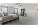 Serene bedroom features soft, natural light, plush carpeting, and a dresser at 17231 Rider Wood Ln, Charlotte, NC 28278