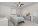 Cozy bedroom featuring a comfortable bed, neutral tones, and soft natural light at 17231 Rider Wood Ln, Charlotte, NC 28278