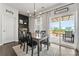 Cozy dining area with sliding glass doors leading to a deck, offering natural light and outdoor access at 17231 Rider Wood Ln, Charlotte, NC 28278