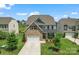 Beautiful two-story home with a brick facade, well-kept lawn, and inviting curb appeal at 17231 Rider Wood Ln, Charlotte, NC 28278