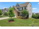 Charming two-story home with well-maintained landscaping and a welcoming front porch at 17231 Rider Wood Ln, Charlotte, NC 28278