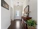 Welcoming foyer with hardwood floors, a decorative mirror, and a stylish console table, setting an elegant tone at 17231 Rider Wood Ln, Charlotte, NC 28278
