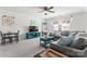 Bright living room with a comfortable gray sofa, TV console, and cozy decor at 17231 Rider Wood Ln, Charlotte, NC 28278