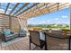 Relaxing outdoor space with comfortable seating and a wooden pergola for shade at 17231 Rider Wood Ln, Charlotte, NC 28278