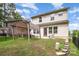 Backyard with pergola, patio furniture, and lush green lawn at 1825 Evergreen Dr, Charlotte, NC 28208