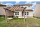 Pergola with patio furniture and fire pit in a well-maintained backyard at 1825 Evergreen Dr, Charlotte, NC 28208