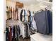 Walk-in closet features racks and shelves for storage and organization at 1825 Evergreen Dr, Charlotte, NC 28208