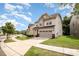 Beautiful view of the home's exterior showing the driveway, landscaping, and well-maintained lawn at 1825 Evergreen Dr, Charlotte, NC 28208
