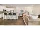Open-concept kitchen featuring a breakfast bar, modern appliances, and seamless access to the living area at 1825 Evergreen Dr, Charlotte, NC 28208