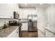 The kitchen offers white cabinets, stainless steel appliances, and granite countertops at 1825 Evergreen Dr, Charlotte, NC 28208