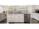Kitchen with granite countertops, stainless steel dishwasher, and bar seating at 1825 Evergreen Dr, Charlotte, NC 28208