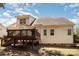 Rear view of a two-story house showcasing the back deck and backyard with a mix of open space at 1846 Sam Smith Rd, Fort Mill, SC 29708