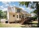 Back exterior showcasing a well-maintained home with a deck, yard, and established landscaping at 1846 Sam Smith Rd, Fort Mill, SC 29708