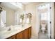 Bathroom featuring double sinks, wood cabinets, and a separate toilet room at 1846 Sam Smith Rd, Fort Mill, SC 29708
