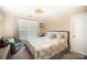 Bedroom with a soft chair, window, and queen-size bed at 1846 Sam Smith Rd, Fort Mill, SC 29708