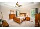 Cozy bedroom with neutral carpet, a ceiling fan, and a queen-size bed at 1846 Sam Smith Rd, Fort Mill, SC 29708