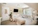 Cozy bedroom with a comfortable seating area, modern TV, and bright natural light from the window at 1846 Sam Smith Rd, Fort Mill, SC 29708