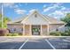 Brick clubhouse featuring a gated entrance, manicured landscaping, and ample parking at 1846 Sam Smith Rd, Fort Mill, SC 29708
