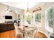Bright dining area with hardwood floors, a vaulted ceiling, and a backyard view at 1846 Sam Smith Rd, Fort Mill, SC 29708
