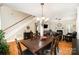 Cozy dining room with hardwood floors, a view of the staircase and living room, and stylish decor at 1846 Sam Smith Rd, Fort Mill, SC 29708
