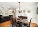 Elegant dining room featuring a wooden table with seating for six and decorative wainscoting and lighting at 1846 Sam Smith Rd, Fort Mill, SC 29708
