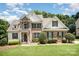 Charming brick and siding home with a well-manicured lawn and a picturesque blue sky. A beautiful two-story Gathering home at 1846 Sam Smith Rd, Fort Mill, SC 29708