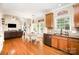 Open-concept kitchen with wooden cabinets, granite countertops, stainless steel appliances and a seamless flow to living areas at 1846 Sam Smith Rd, Fort Mill, SC 29708