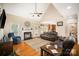 Comfortable living room with hardwood floors, a fireplace, and plenty of natural light at 1846 Sam Smith Rd, Fort Mill, SC 29708