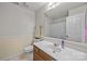 Well-lit bathroom with a single sink vanity, large mirror, and neutral tones for a clean and inviting space at 212 Foxfield Ln, Matthews, NC 28105