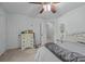 Cozy bedroom featuring a ceiling fan, closet, and doorway to the connecting hall and bathroom at 212 Foxfield Ln, Matthews, NC 28105