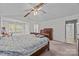 Another view of the spacious bedroom boasts vaulted ceilings, plush carpet, and a large window offering ample natural light at 212 Foxfield Ln, Matthews, NC 28105