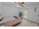 Cozy bedroom with a patterned bedspread, ample light, and a closet to make it a functional space at 212 Foxfield Ln, Matthews, NC 28105