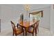 Bright dining room featuring a chandelier and a view of the outdoors at 212 Foxfield Ln, Matthews, NC 28105