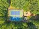 Overhead view of tennis courts and playground, surrounded by trees, enhancing the community's appeal at 212 Foxfield Ln, Matthews, NC 28105
