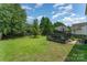 Large backyard with a deck, hammock, and plenty of space for outdoor activities at 2240 Arbor Vista Dr, Charlotte, NC 28262