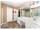 Bathroom showcasing double sinks, a walk-in closet, and decorative mirrors at 2240 Arbor Vista Dr, Charlotte, NC 28262