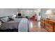 Spacious bedroom featuring wood floors, a cozy sitting area, and natural light at 2240 Arbor Vista Dr, Charlotte, NC 28262
