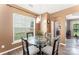 Cozy breakfast nook with a modern light fixture, hardwood floors, and a view of the backyard at 2240 Arbor Vista Dr, Charlotte, NC 28262