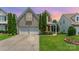 Charming two-story home with a well-manicured lawn and attached two-car garage at 2240 Arbor Vista Dr, Charlotte, NC 28262
