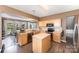 Functional kitchen with wood cabinets, stainless steel appliances, and a breakfast nook at 2240 Arbor Vista Dr, Charlotte, NC 28262