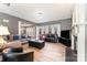 Inviting living room with a fireplace, comfortable seating, hardwood floors, and neutral color at 2240 Arbor Vista Dr, Charlotte, NC 28262
