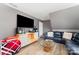 Cozy living room featuring a large TV, comfortable seating, and stylish decor at 2240 Arbor Vista Dr, Charlotte, NC 28262