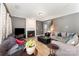 Inviting living room with a fireplace, comfortable seating, and hardwood flooring at 2240 Arbor Vista Dr, Charlotte, NC 28262