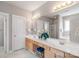 Bathroom featuring double sinks, a soaking tub and a standing shower at 2619 Merion Hills Ct, Charlotte, NC 28269