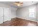 Neutral bedroom with hard floors, ceiling fan and a double door closet at 2619 Merion Hills Ct, Charlotte, NC 28269