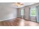 Unfurnished bedroom featuring hardwood floors and 2 large windows at 2619 Merion Hills Ct, Charlotte, NC 28269