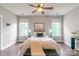 Beautiful bedroom with a ceiling fan, hard wood floors, and two windows for natural light at 2619 Merion Hills Ct, Charlotte, NC 28269