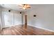 Unfurnished bedroom featuring hardwood floors, large closets and a ceiling fan at 2619 Merion Hills Ct, Charlotte, NC 28269