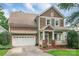Charming two-story home features a welcoming front porch and a two-car attached garage at 2619 Merion Hills Ct, Charlotte, NC 28269