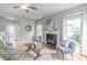 Inviting living room with a fireplace, hardwood floors, and an open layout with plenty of natural light at 2619 Merion Hills Ct, Charlotte, NC 28269
